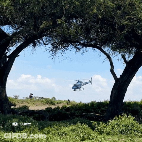Helicopter Flying Over Field With W2C Logo GIF