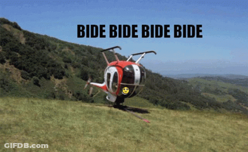 Helicopter Flying Over Grassy Hillside Saying Bide Bide Bide Bide GIF