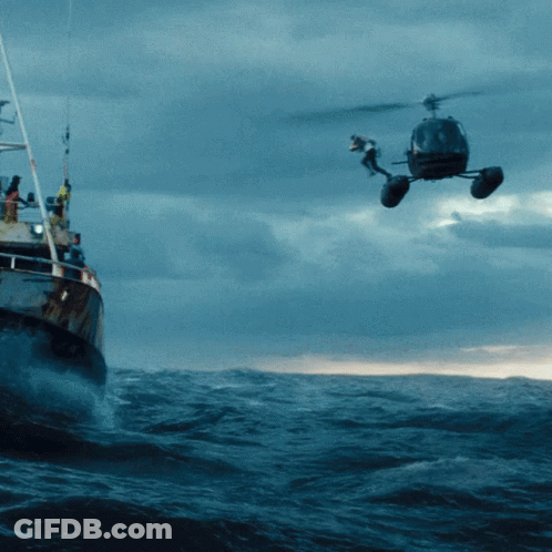 Helicopter Hovering Over Boat In Ocean GIF