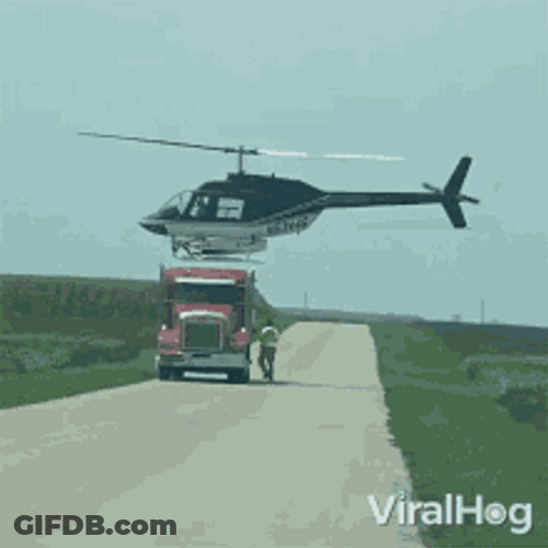 Helicopter Landing Top Of Truck Middle Of Road GIF
