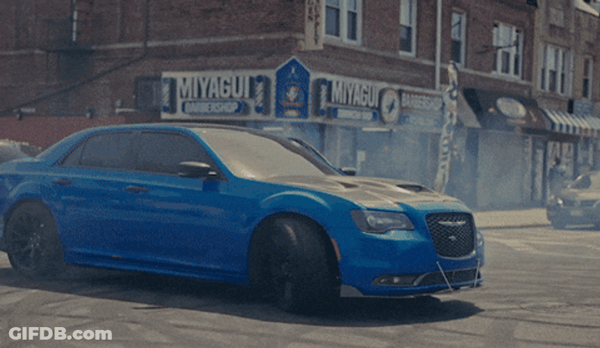 Hellcat Drifting Between Parked Cars GIF