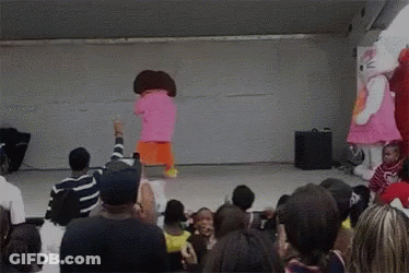 Hello Kitty And Dora The Explorer Are Dancing In Front Of A Crowd Of People GIF