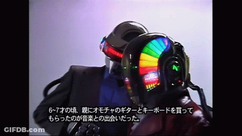 Helmeted Men Talking, One In Suit GIF