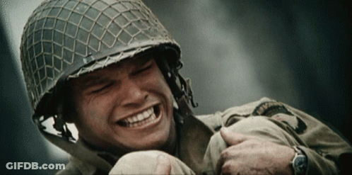 Helmeted Soldier Smiling Holding Another Soldier's Arm GIF
