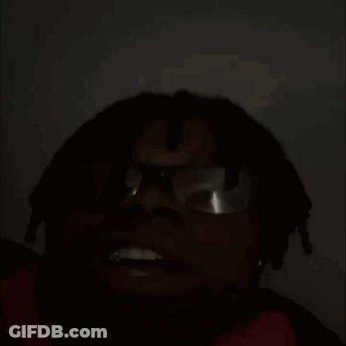Hennessy Bottle On Couch Beside Man With Glasses GIF