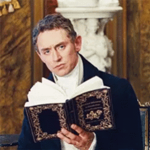 Henry Nobley Staring With A Book GIF