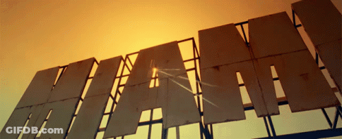 Hi-Way Sign Against Sunset Sky GIF