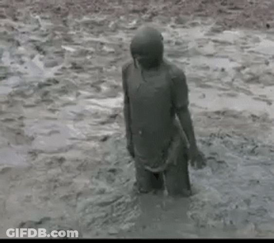Hilarious Kid Diving Faceplant On Mud GIF
