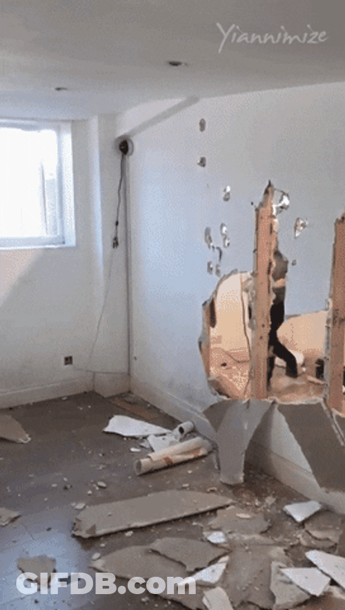 Hilarious Prankster Bangs Head Against Wall GIF