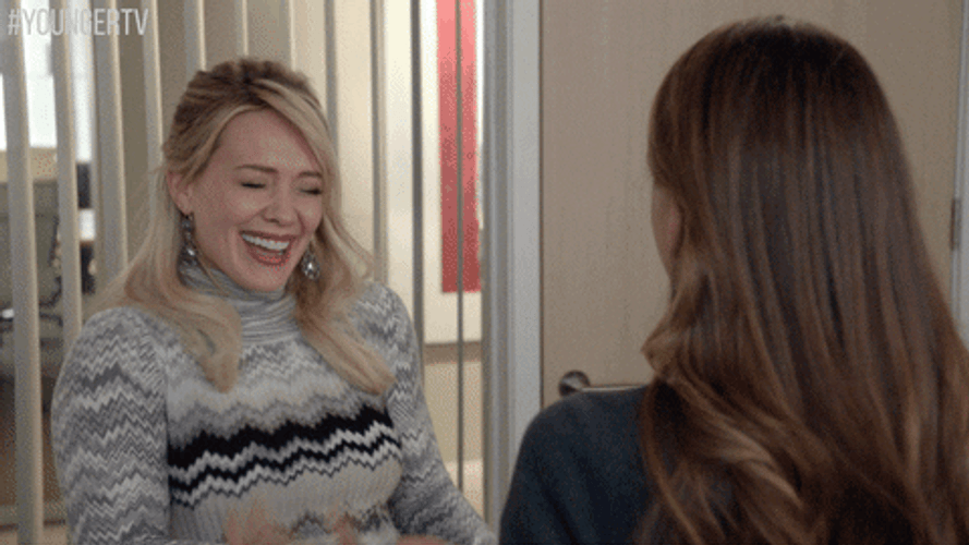 Hilary Duff Giggling With Friend GIF