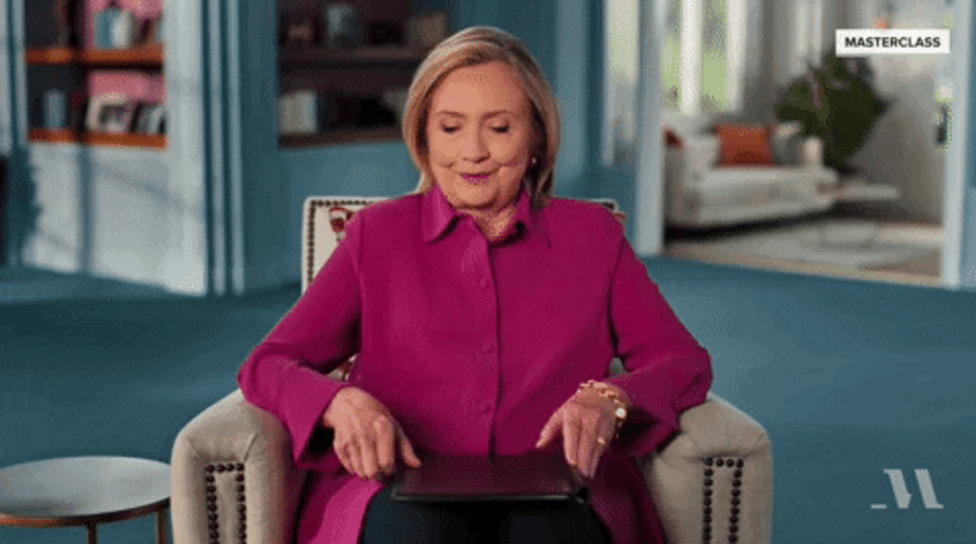 Hillary Clinton Opening Book For Her Speech GIF