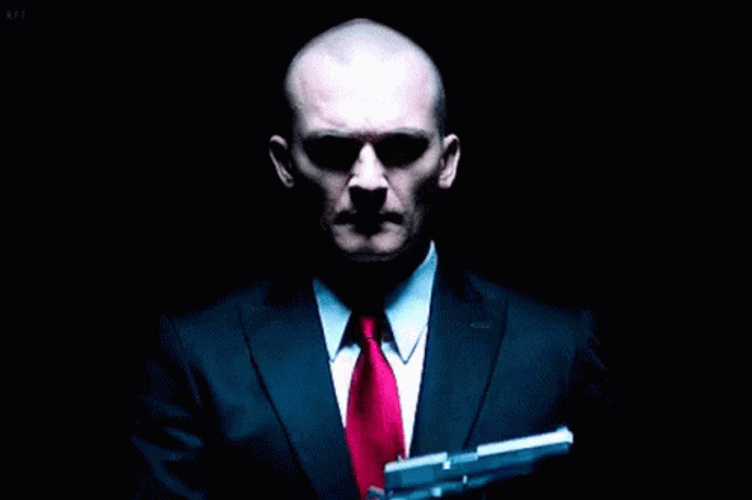 Hitman Fixing His Glove GIF