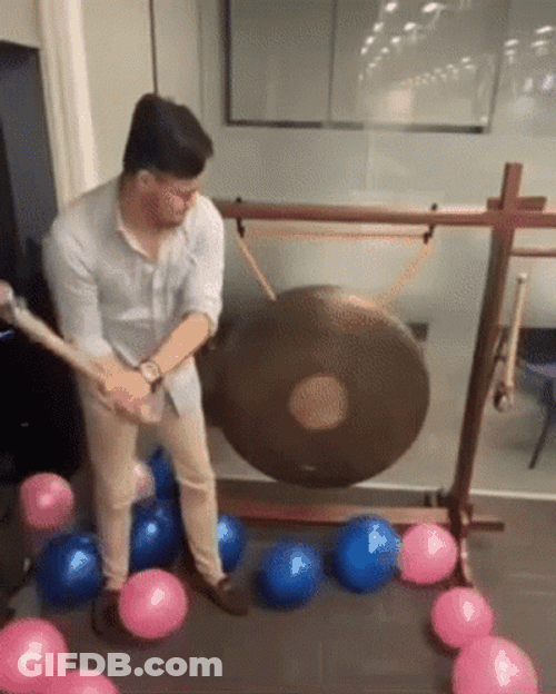 Hitting Gong Metal Finger Heart GIF