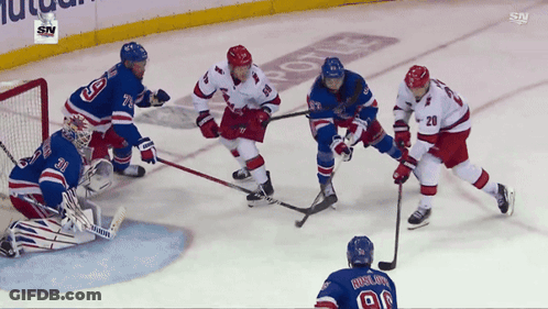 Hockey Game Being Played GIF