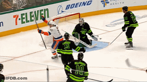 Hockey Game In Front Of 7-Eleven And Boeing Ads GIF