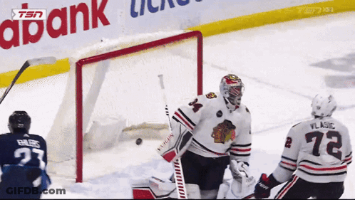 Hockey Game In Front Of Abank Banner GIF