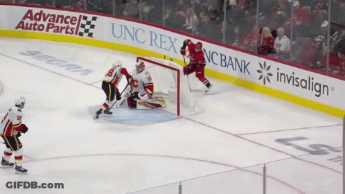 Hockey Game In Front Of Advance Auto Parts Banner GIF