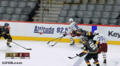 Hockey Game In Front Of Altitude 92.5 Banner GIF