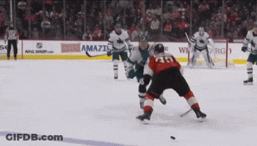 Hockey Game In Front Of Amazi Ad GIF