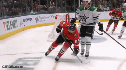 Hockey Game In Front Of Boeing And 7-Eleven Ads GIF