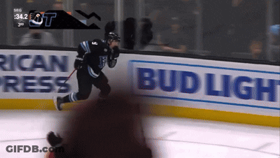 Hockey Game In Front Of Bud Light Sign GIF