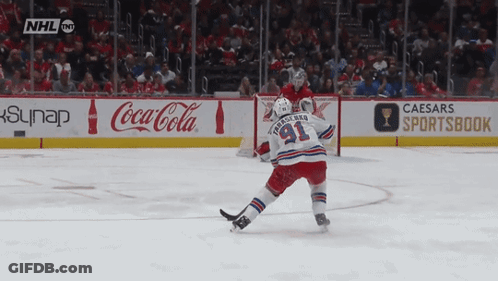 Hockey Game In Front Of Caesars Sportsbook Sign GIF
