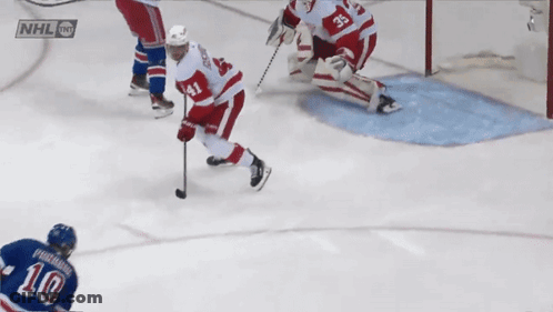 Hockey Game In Front Of Chase And Spectra Ads GIF
