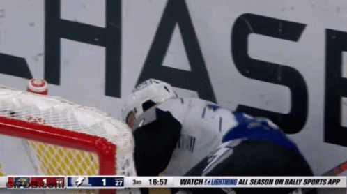 Hockey Game In Front Of Chase Sign GIF