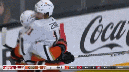 Hockey Game In Front Of Coca Cola Ad GIF