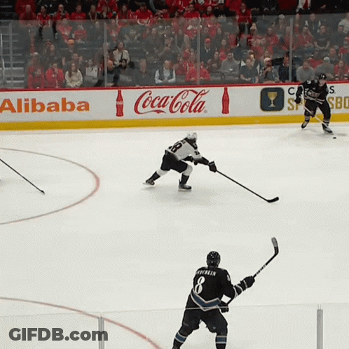 Hockey Game In Front Of Coca-Cola Ads GIF