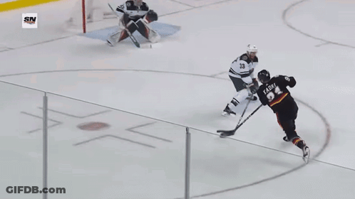 Hockey Game In Front Of Coca Cola Sign GIF