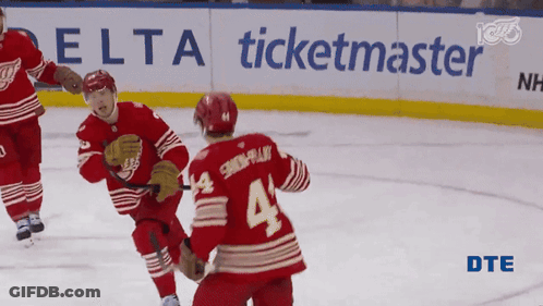 Hockey Game In Front Of Delta Ticketmaster Ad GIF