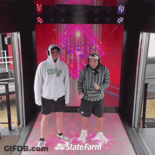 Hockey Game In Front Of Divsal Sign GIF
