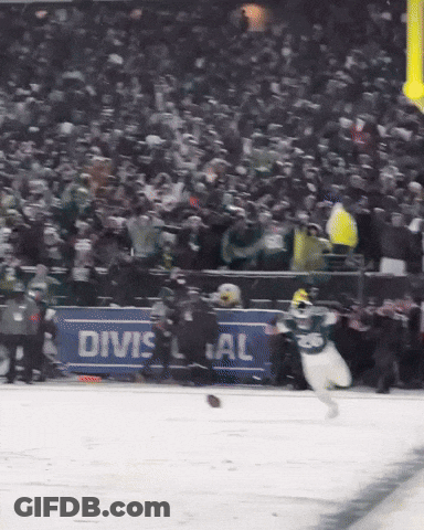 Hockey Game In Front Of Divsal Sign GIF