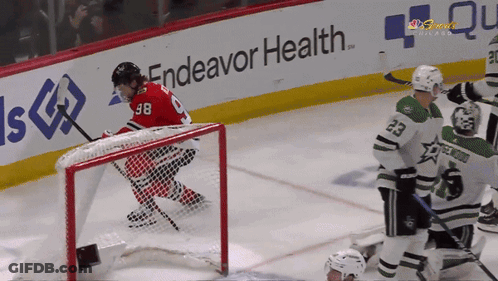 Hockey Game In Front Of Endeavor Health Sign GIF
