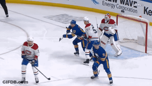 Hockey Game In Front Of Energy Ad GIF