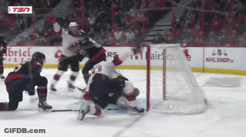 Hockey Game In Front Of Gabriel Pizza Ad GIF