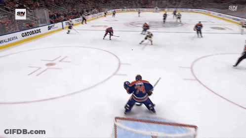 Hockey Game In Front Of Gatorade Sign GIF