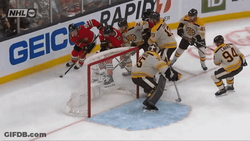 Hockey Game In Front Of Geico Ad GIF