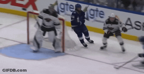 Hockey Game In Front Of GTE Sign GIF