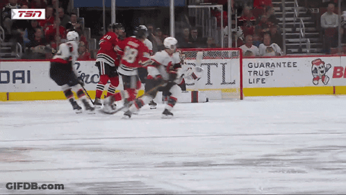 Hockey Game In Front Of Guarantee Trust Life Ad GIF