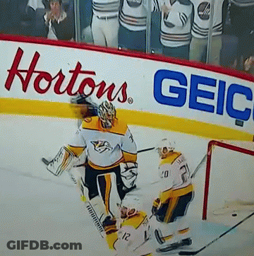 Hockey Game In Front Of Hortons Geico Sign GIF