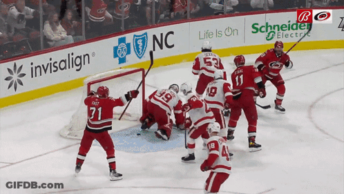 Hockey Game In Front Of Invisalign Banner GIF