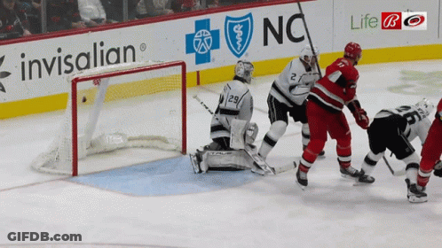 Hockey Game In Front Of Invisalign Sign GIF
