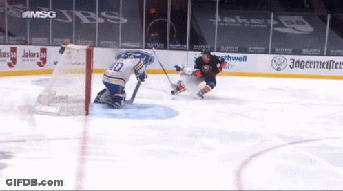 Hockey Game In Front Of Jagermeister Sign GIF