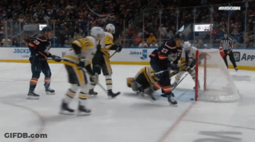 Hockey Game In Front Of Jakes Sign GIF