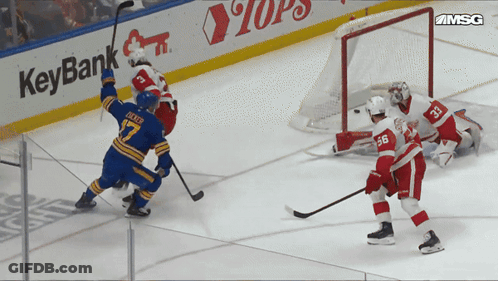 Hockey Game In Front Of KeyBank Sign GIF