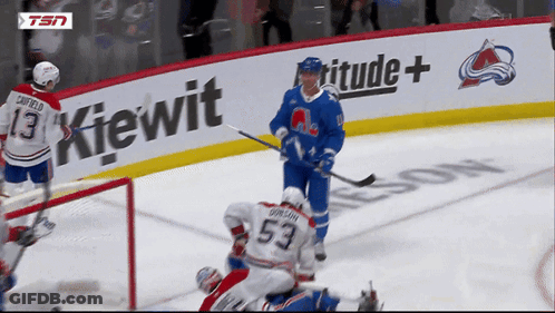 Hockey Game In Front Of Kiewit Sign GIF