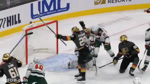 Hockey Game In Front Of Limc Ad GIF