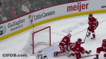 Hockey Game In Front Of Meijer Sign GIF